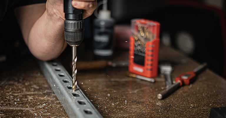 Drilling through metal